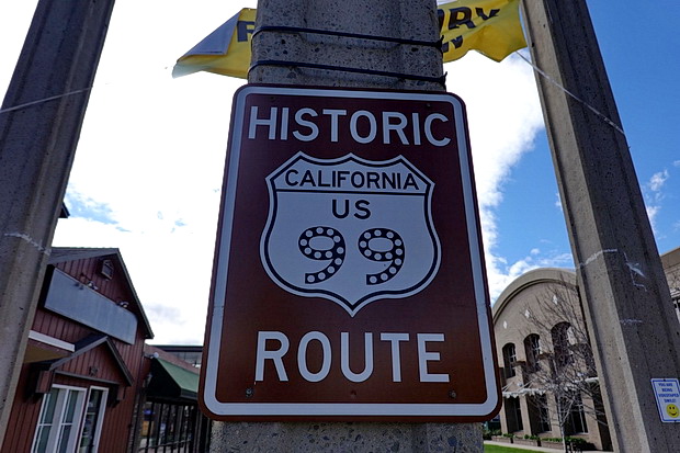 On tour in America: signs, street lights, wires and stop signs