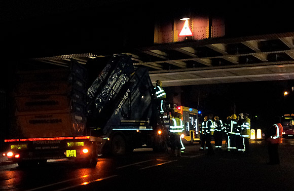 Bam! Skip lorry smashes into rail bridge on Barrington Road, Brixton