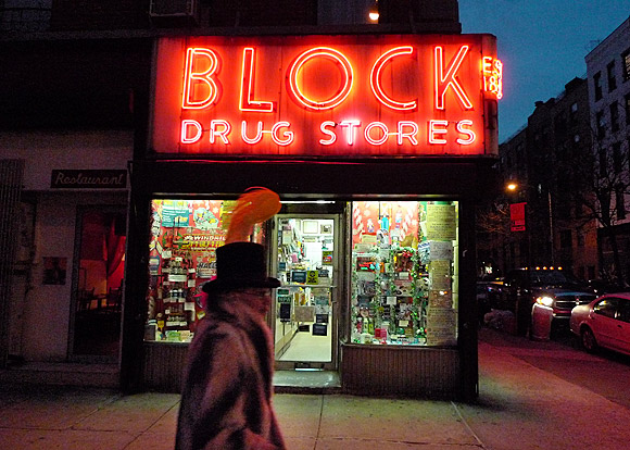 NYC street scene: Blocks drug stores and feather top hat