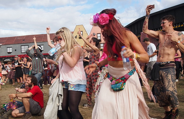 Faces in the crowd: scenes from Boomtown's Town Centre, Boomtown Fair Festival 2015, Winchester, England, UK, August 2015
