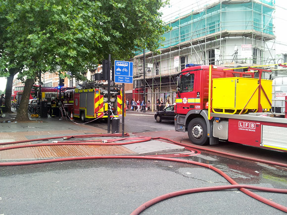 Brixton Footlocker fire smoulders on, tube station and shops still closed