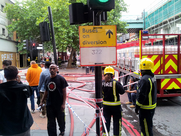 Brixton Footlocker fire smoulders on, tube station and shops still closed