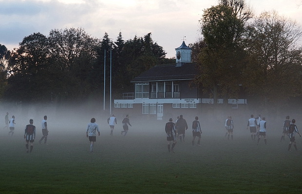 Ghostly football -players hunt the ball in the swirling mists of Molesey, Surrey, Saturday 15th November 2014
