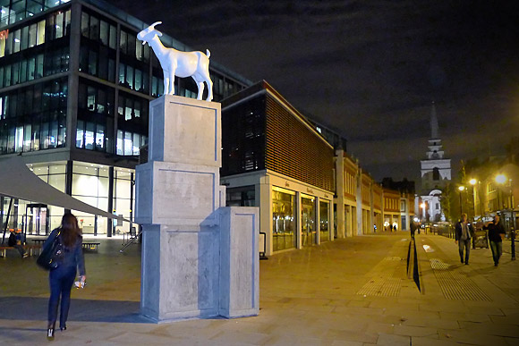 It's a goat. On a pile of boxes. In Spitalfields, London