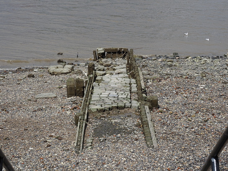 The River Thames at low tide: mudlarkers, sunbathers and bridges