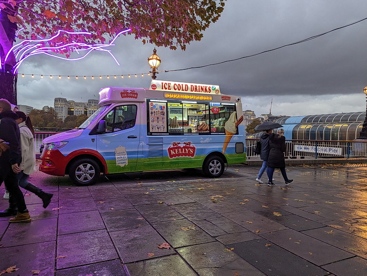 In photos: London's South Bank at dusk: dark clouds, neon trees and umbrellas