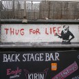 Appearing opposite the Brixton Academy at the back of the Backstage Bar (on Astoria Walk, SW9) was this “Thug For Life” graffiti by Banksy.
