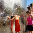Cooling off in Cardiff Bay at the Torchwood Tower On a red hot August afternoon in 2004, kids are seen cooling off in the water feature in Cardiff bay (also known as the Torchwood Tower after its appearances in the BBC...