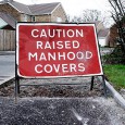 Photo of the day: raised manhood covers Spotted in Thornhill, north Cardiff, February 2004.