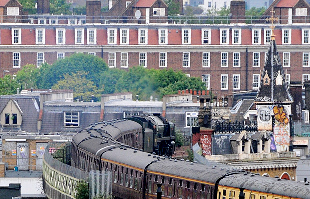 Britannia 7000 loco steams past Brixton