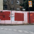 Street scene showing artwork on hoardings at the junction of Herne Hill Road and Wanless Road, SE24, close to Loughborough Junction.