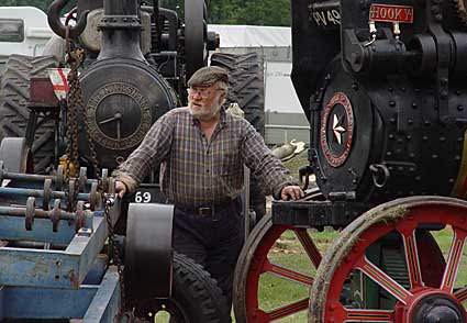 Old fella attending to the steam traction engines, Lambeth Country Fair, Brockwell Park, Herne Hill, London 17th-18th July 2004