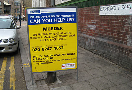 Yellow police incident board. Murder. A Male was fatally shot in Clarence House, Rushcroft Road, Brixton, SW9, 9.38pm Friday 27th April 2007