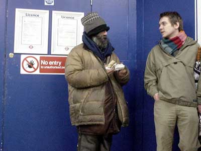Tramp in conversation, Brixton tube station, Jan 2002