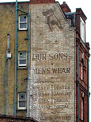 Old 'Our Sons Ltd' menswear painted sign, Electric Lane and Electric Avenue, Brixton, London