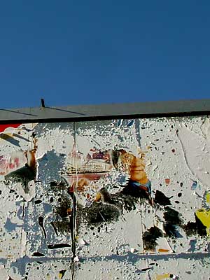 Peeling billboard outside Cooltan, Coldharbour Lane, Brixton, Lambeth, London, England SW9