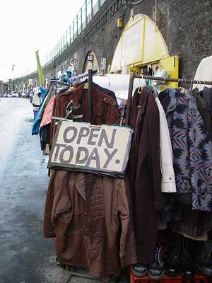 Open today, secondhand clothes store, Brixton Station Road, Brixton, Lambeth, London, England SW9