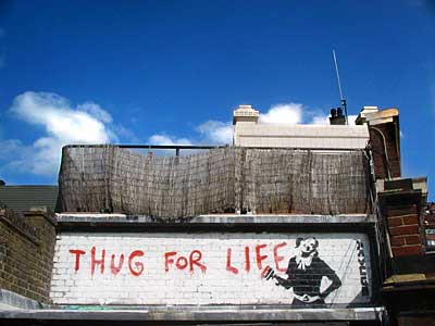'Thug for Life', Banksy stencil graffiti, Brixton, Lambeth, London, England SW9