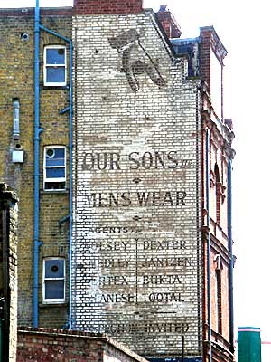 Old Menswear advert, Electric Lane, Brixton, Lambeth, London, England SW9