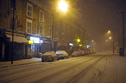 A snowy night in Brixton, Lambeth, London SW9 - scenes on Electric Avenue, Coldharbour Lane, Brixton Road, 2nd February 2009