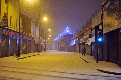 A snowy night in Brixton, Lambeth, London SW9 - scenes on Electric Avenue, Coldharbour Lane, Brixton Road, 2nd February 2009