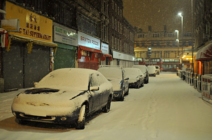 A snowy night in Brixton, Lambeth, London SW9 - scenes on Electric Avenue, Coldharbour Lane, Brixton Road, 2nd February 2009