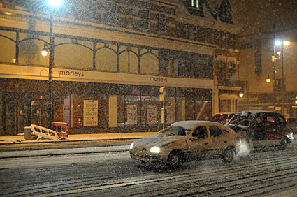 A snowy night in Brixton, Lambeth, London SW9 - scenes on Electric Avenue, Coldharbour Lane, Brixton Road, 2nd February 2009