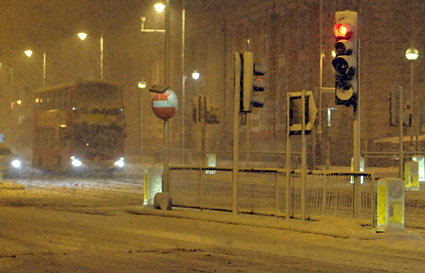 A snowy night in Brixton, Lambeth, London SW9 - scenes on Electric Avenue, Coldharbour Lane, Brixton Road, 2nd February 2009