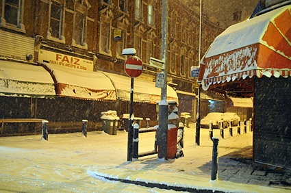 A snowy night in Brixton, Lambeth, London SW9 - scenes on Electric Avenue, Coldharbour Lane, Brixton Road, 2nd February 2009
