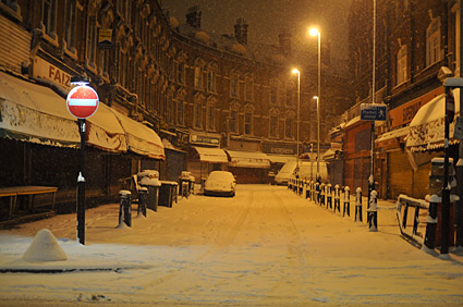 A snowy night in Brixton, Lambeth, London SW9 - scenes on Electric Avenue, Coldharbour Lane, Brixton Road, 2nd February 2009