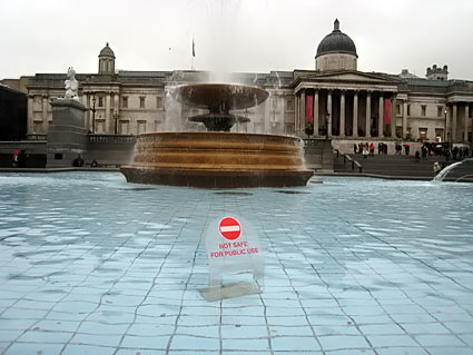 'Not safe for public use.' Fountains in Trafalgar Square. , A rainy day in central London, January, 2007