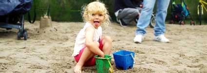 Young girl building a sandcastle, Reclaim the Beach, Festival Pier, Thames, London