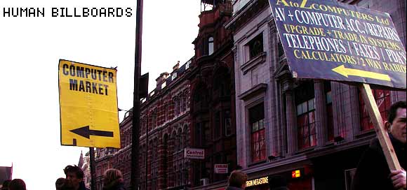 Human billboards and sandwich board advertising on the streets of London, England UK