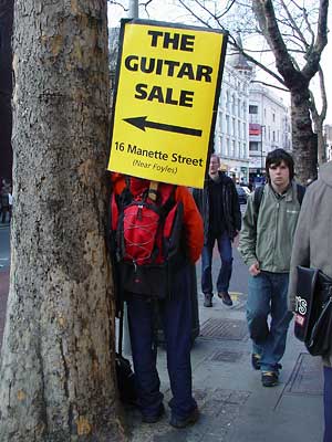 Human billboard, The Guitar Sale, Charing Cross Road, London UK
