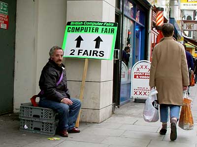 Cigarette break, human billboard, British Computer Fairs,  Tottenham Court Road London W1