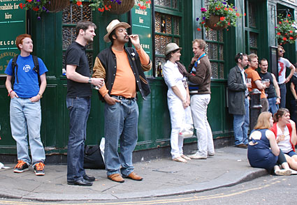 Enjoying a cigar, Market Porter pub, Borough Market,  London, July 2007