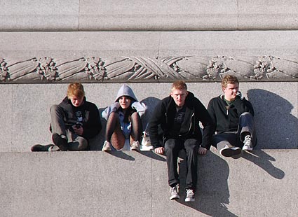 Sitting on the base of Nelson's Column, Trafalgar Square, London, March 2007