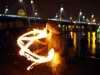Fire juggler by the Thames, London