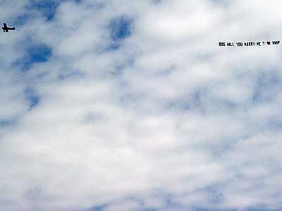 Flying marriage proposal on a banner, Big Chill festival, Eastnor Castle 2004, England UK