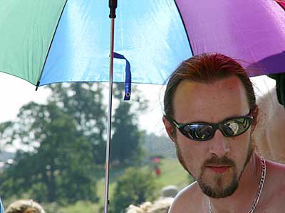Toby and brolly, Big Chill festival, Eastnor Castle 2004, England UK