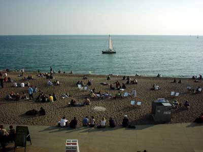 Brighton beach, sunbathers and boat