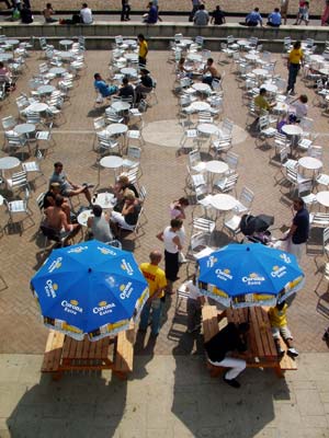 Empty chairs and tables, Brighton seafront, May 2003