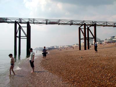 Paddlers and West Pier walkway, Brighton beach, May 2003