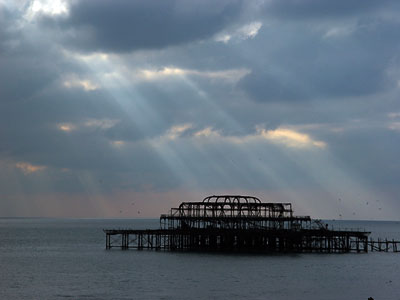 Stormy clouds and sun, West Pier, Brighton, East Sussex