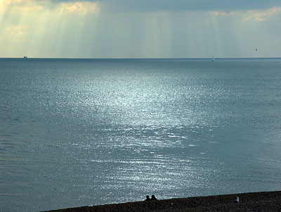 Looking at a distant ship, Brighton, East Sussex