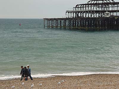 Walking past the West Pier, Brighton West Pier, Brighton, East Sussex