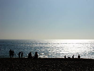 Silhouettes on the beach, Brighton, East Sussex