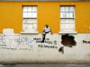 Yellow wall and graffiti Brighton beach