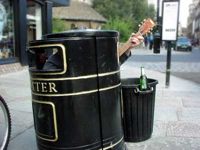 Busker in a bin, Cambridge, England