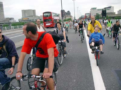 Cyclists over Waterloo Bridge, Critical mass bike ride, London, 27th June 2003